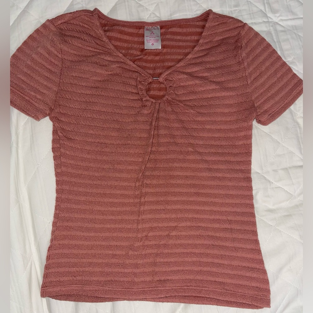 Pink shirt with silver ring
